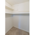 Walk-in closet with clothes rods and built-in shelves at The Lafayette at Valley Forge apartments in King of Prussia, PA.