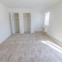 Carpeted bedroom with double closets at The Lafayette at Valley Forge apartments in King of Prussia, PA.