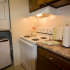 White stove and in-unit laundry in Red Bank Run townhome kitchen