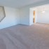 Beige carpeting in spacious living and dining area in Red Bank Run Townhomes for rent