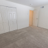 Carpeted bedroom with closet at Wyntre Brooke apartments in West Chester, PA.