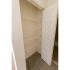 Model bedroom closet with utility shelving at Wyntre Brooke apartments in West Chester, PA.