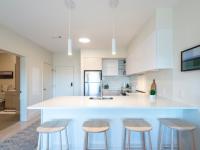 Apartment Kitchen with Breakfast Bar and Pendant Lights