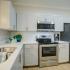Platinum Kitchen with stainless appliances Lunaire Apartments | Goodyear, Arizona