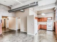 Trendy loft living with exposed beams - interior brick | Cold Storage Lofts | Kansas City Apartments |