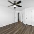 Renovated Apartment - Wood-plank flooring, sliding doors, ceiling fan in bed room at  | The Residence at Turnberry | Columbus Apartments