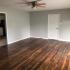Ceiling Fan & Wood-plank Style Flooring in Open-Concept Living Area at Steeplechase Village; Columbus Apartments