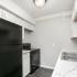 black appliances and white countertops
