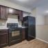 kitchen with black appliances at Silver Springs Apartments in Springfield MO