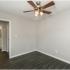bedroom with ceiling fan at Woodgate Apartments in Springfield MO