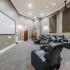 Media screening room with recliners at Edge at Lafayette | University Housing Lafayette, LA