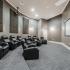 Media room with extra large screen & recliners at Edge at Lafayette | Lafayette, Louisiana Apartments