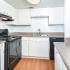 Kitchen | Black Appliances | Plank Flooring | Austin TX