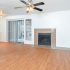 Fireplace in Living Area | Plank Flooring | Silver Creek Apartments