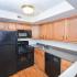 Kitchen with Black Appliances | 2 Bedroom Apartments