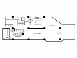 Floor plan featuring two bedrooms, two bathrooms, laundry area, living area, dining area, and kitchen.