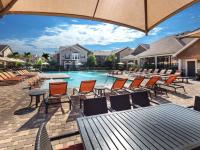 Pool with Table | Apartments in Tomball, TX | Avenues at Northpointe