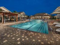 Resort-Style Pool at Dusk | Apartments in Cypress, TX | Avenues at Cypress