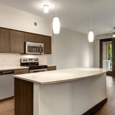 Residents Snacking in the Kitchen | Apartments For Rent Hillsboro Oregon | Tessera at Orenco Station 2
