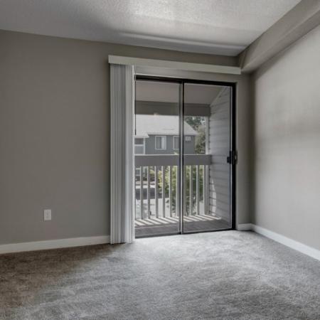 Living Room with Balcony Access | Apartments for Rent in Beaverton Oregon | Arbor Creek