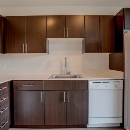 718 Kitchen with Over the Refrigerator Storage HANA Apartments | Apartments Seattle WA