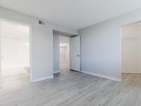 Newly renovated large bedrooms with  light sand plank flooring  and spacious walk in closets