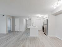 Nwewly renovated apartments with light sand plank flooring and stainless appliance package