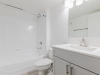 Newly renovated bright bathrooms with garden tub and shsker sytle cabinetry