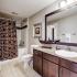 Bathroom with large vanity mirror and granite counter tops