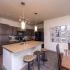 Modern Kitchen with Quartz Countertops and Pendant Lighting  | Apartment Homes In Nashville | 909 Flats