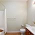 Spacious and Well-Lit Bathroom with Shower and Tub | Canton Woods apartments in MA