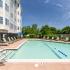Pool with Lounge Chairs Surrounding | Canton Woods apartments in MA