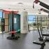 The Strand - Community Fitness Center With a Variety of Equipment, Floor to Ceiling Windows, and Inspirational Wall Decoration