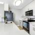 All white kitchen with stainless appliance package