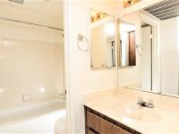 full bath with shower tub combo and beige vanity at silver creek
