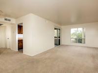 living room with beige carpet and sliding doors to balcony at Bridge Lane