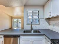 kitchen with granite countertops and stainless steel appliances and at redfield ridge apartments
