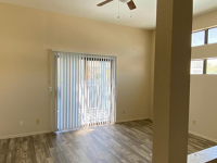 living room with vinyl wood like flooring and ceiling fan at Monterey Apartments