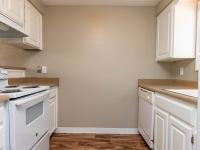 Kitchen with White Cabinets & Brown Counters