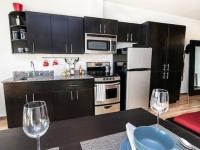 kitchen with espresso cabinets at milano apartments