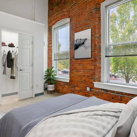 Exposed Brick Bedroom | Millbury MA Apartments | Cordis Mills