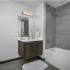 Bathroom featuring quartz countertops.