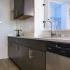 The Graham at Southern Towers updated kitchen with dark wood cabinets