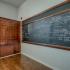 Chalkboard and built in cabinet from original school building.