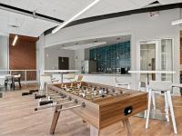 Billiards area with foosball and shuffle board