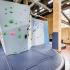 Indoor rock climbing wall with safety pad below.