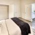 Bedroom on-suite with tub and concrete floors.