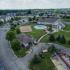 Ariel view of outdoor amenities, pool, volleyball court, basketball court, at The Landings at Chandler Crossings | East Lansing MSU Off-Campus Apartments