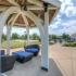Pagoda providing shade with comfortable seating at The Landings at Chandler Crossings | Student Housing Near Michigan State University