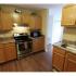 Long Pond Village Apartments, interior, wood flooring, stainless steel stove/oven, microwave, tan cabinets